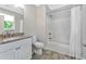 Bright bathroom with granite counters, a white vanity, and a shower-tub combination at 3304 Palm St., North Myrtle Beach, SC 29582