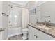 Well-maintained bathroom with a tub, shower, and a granite-topped vanity with a sink at 3304 Palm St., North Myrtle Beach, SC 29582