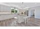 Bright kitchen showcasing granite counters, a center island with seating, and stainless steel appliances at 3304 Palm St., North Myrtle Beach, SC 29582