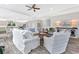 Bright living room featuring stylish furniture and an open floor plan with modern gray-wash flooring at 3304 Palm St., North Myrtle Beach, SC 29582