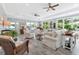 Spacious living room with floor to ceiling windows, plush seating, and lots of natural light at 3304 Palm St., North Myrtle Beach, SC 29582