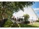 Spacious backyard includes a patio with seating, mature trees, and a fenced perimeter at 417 Pennington Loop, Myrtle Beach, SC 29588