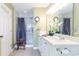 Bright bathroom featuring a walk-in shower and a white vanity with a large mirror at 417 Pennington Loop, Myrtle Beach, SC 29588