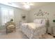 Inviting bedroom with decorative wrought iron detail, plantation shutters, and a cozy bedspread at 417 Pennington Loop, Myrtle Beach, SC 29588