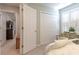 Charming bedroom featuring plantation shutters and an open doorway to a hallway at 417 Pennington Loop, Myrtle Beach, SC 29588