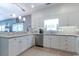 Spacious kitchen featuring white cabinetry, stainless steel appliances, and granite countertops at 417 Pennington Loop, Myrtle Beach, SC 29588