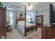 Serene primary bedroom with natural light, neutral colors, and a four-poster bed at 417 Pennington Loop, Myrtle Beach, SC 29588