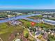 Beautiful aerial view of the Intercoastal Waterway showcasing marshlands, a marina, and residential waterfront community at 4490 Barcelona Ln., Little River, SC 29566