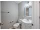 Bathroom featuring a single sink vanity, with a framed mirror and toilet at 4490 Barcelona Ln., Little River, SC 29566