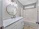 This bathroom offers a sleek vanity with modern fixtures and a shower-tub combo for a relaxing experience at 4490 Barcelona Ln., Little River, SC 29566