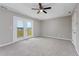 Bedroom with carpet, walk out to a deck, and gray walls at 4490 Barcelona Ln., Little River, SC 29566