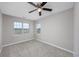 Bedroom with carpet, two windows and gray walls at 4490 Barcelona Ln., Little River, SC 29566