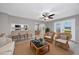 Inviting living room featuring comfortable seating, view of dining area and kitchen bar and access to the outdoor deck at 4490 Barcelona Ln., Little River, SC 29566