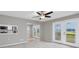 Open concept living space with access to outdoor views from the living room and direct views of the kitchen at 4490 Barcelona Ln., Little River, SC 29566