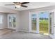Open living space with multiple doors leading to the outdoor deck overlooking scenic marsh views at 4490 Barcelona Ln., Little River, SC 29566
