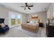 This is a bedroom with a wooden bed, an area rug, and french doors with a view at 4490 Barcelona Ln., Little River, SC 29566