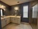 Elegant bathroom featuring double sink vanity, neutral color walls, decorative lighting, and a glass-enclosed shower at 454 Pacific Commons Dr., Surfside Beach, SC 29575