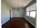 Minimalist dining room with elegant light fixture and large window with neutral color palette at 454 Pacific Commons Dr., Surfside Beach, SC 29575