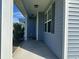 Inviting front porch with a view of the neighborhood, perfect for relaxing outdoors at 454 Pacific Commons Dr., Surfside Beach, SC 29575