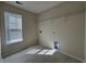 Clean, well-lit laundry room with tiled floor, utility sink, shelving, and washer and dryer hookups at 454 Pacific Commons Dr., Surfside Beach, SC 29575