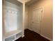 Well-organized mudroom entryway featuring a built-in bench with hooks and storage, perfect for keeping tidy at 454 Pacific Commons Dr., Surfside Beach, SC 29575