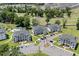 Aerial of condo community showing multiple buildings, parking areas, and lush green spaces at 493 White River Dr. # 28-D, Myrtle Beach, SC 29579