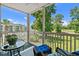 Relaxing screened balcony with chairs overlooking the golf course and community pool at 493 White River Dr. # 28-D, Myrtle Beach, SC 29579