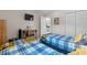Cozy bedroom featuring two twin beds, a desk, and closet space for comfortable living at 493 White River Dr. # 28-D, Myrtle Beach, SC 29579