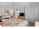 This bedroom includes a full closet, ceiling fan, television and an ensuite bathroom at 493 White River Dr. # 28-D, Myrtle Beach, SC 29579