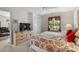 Comfortable bedroom features a large TV, dresser, and golf course view at 493 White River Dr. # 28-D, Myrtle Beach, SC 29579