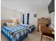 Twin beds in a cozy bedroom with a desk and dresser at 493 White River Dr. # 28-D, Myrtle Beach, SC 29579