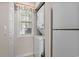 Washer and dryer units are neatly arranged in a dedicated laundry space with a window at 493 White River Dr. # 28-D, Myrtle Beach, SC 29579