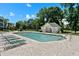 Community pool area with comfortable lounge chairs and a charming pool house, perfect for relaxation at 493 White River Dr. # 28-D, Myrtle Beach, SC 29579