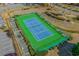 Well-maintained tennis court surrounded by lush greenery for recreational activities and fitness at 493 White River Dr. # 28-D, Myrtle Beach, SC 29579