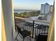 Scenic balcony view overlooking parking lot and beach, with ocean in background at 504 Ocean Blvd. N # 410, Myrtle Beach, SC 29577