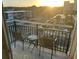 Balcony view with chairs and table overlooking street below at 504 Ocean Blvd. N # 410, Myrtle Beach, SC 29577
