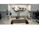 Detailed view of kitchen sink features marble countertop and elegant backsplash at 504 Ocean Blvd. N # 410, Myrtle Beach, SC 29577