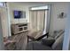 Cozy living room featuring a comfortable sofa, TV, and decor at 504 Ocean Blvd. N # 410, Myrtle Beach, SC 29577