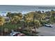 Balcony ocean view of a park with palm trees and parking below at 504 Ocean Blvd. N # 410, Myrtle Beach, SC 29577