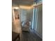 Sitting area by sliding door features accent chair and decor at 504 Ocean Blvd. N # 410, Myrtle Beach, SC 29577
