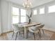 Charming dining room with a modern chandelier and ample natural light at 512 9Th Ave. S, North Myrtle Beach, SC 29582