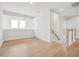 Upstairs hallway with light wood floors and a railing overlooking the staircase at 512 9Th Ave. S, North Myrtle Beach, SC 29582