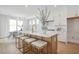 Open-concept kitchen boasts a large island with seating and stylish pendant lighting at 512 9Th Ave. S, North Myrtle Beach, SC 29582