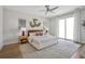 Serene main bedroom suite with a ceiling fan, neutral decor, and a sliding glass door at 512 9Th Ave. S, North Myrtle Beach, SC 29582