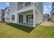 Covered patio with white columns leads out to a lush green yard through sliding glass doors at 512 9Th Ave. S, North Myrtle Beach, SC 29582