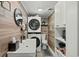 Small bathroom featuring a stacked washer/dryer and white vanity at 5511 N Ocean Blvd. # 902, Myrtle Beach, SC 29577