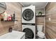 Small bathroom featuring a stacked washer/dryer and white vanity at 5511 N Ocean Blvd. # 902, Myrtle Beach, SC 29577