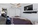 Bright bedroom featuring a TV and stacked washer and dryer at 5511 N Ocean Blvd. # 902, Myrtle Beach, SC 29577