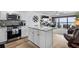 Open living space with modern kitchen, dining area, and sliding doors leading to the balcony at 5511 N Ocean Blvd. # 902, Myrtle Beach, SC 29577