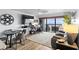 Living room with desk, ocean views, and slider door to the balcony at 5511 N Ocean Blvd. # 902, Myrtle Beach, SC 29577